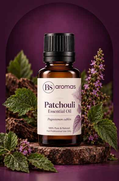 Patchouli Essential Oil bottle surrounded by patchouli leaves